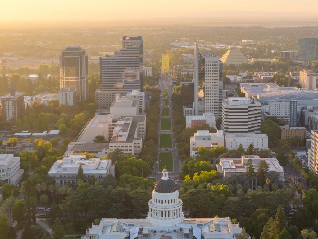 A stunning aerial view of Sacramento, California at sunrise with a focus on the Capitol building.
